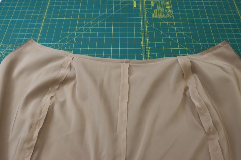 How To Pin Sew Waistlines Right Sides Together - Stretch Polyester Lining - Mood Fabrics - Peak Pencil Skirt Free Sewing Pattern Tutorial - MDF507 - Mood Fabrics Sewciety Blog - Pin and sew the waistlines of the skirts together.