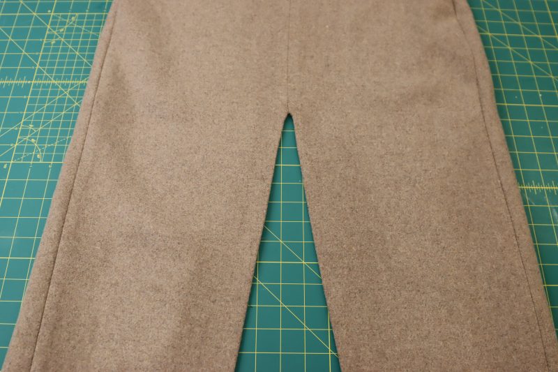 How To Flip Skirt Right Sides Out - Brushed Wool Twill - Mood Fabrics - Peak Pencil Skirt Free Sewing Pattern Tutorial - MDF507 - Mood Fabrics Sewciety Blog - Flip the skirt right sides out and press the slit.