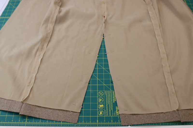 How To Pin Lining Slit To Shell Slit - Brushed Wool Twill - Mood Fabrics - Peak Pencil Skirt Free Sewing Pattern Tutorial - MDF507 - Mood Fabrics Sewciety Blog - Pin the lining to the shell at the front slit.