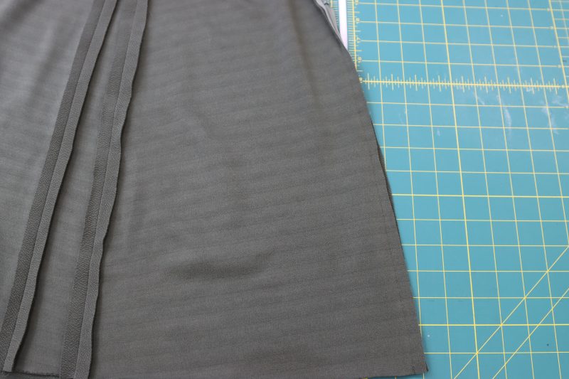 How To Pin Sew Center Back Seam - Stretch Liverpool Knit - Mood Fabrics - Marin Mini Skirt Free Sewing Pattern Tutorial - MDF499 - Mood Fabrics Sewciety Blog - Pin and sew the center back seam of the skirt under the zipper.