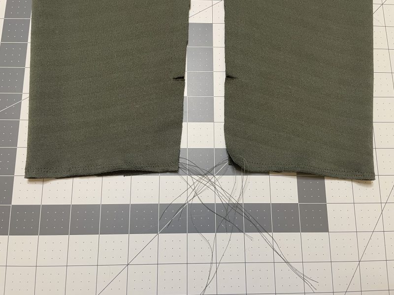 How To Sew Gathering Stitches On Sleeve Hems - Gutermann Sew All Thread - Mood Fabrics - Cove Collared Wrap Top Free Sewing Pattern Tutorial - MDF498 - Mood Fabrics Sewciety Blog - Sew gathering stitches around the wrist of the sleeve.