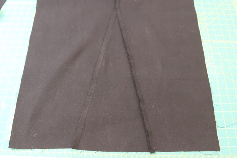 How To Sew Side Bottom Pieces To Front Pant - Cotton Canvas - Mood Fabrics - Clarkston Carpenter Pants Free Sewing Pattern Tutorial - MDF503 - Mood Fabrics Sewciety Blog - Sew the side bottom triangle panel to the front pants pieces.