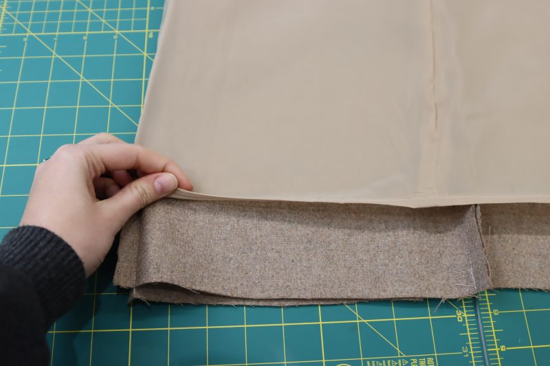 How To Sew Baby Hem On Lining - Stretch Polyester Lining - Mood Fabrics - Peak Pencil Skirt Free Sewing Pattern Tutorial - MDF507 - Mood Fabrics Sewciety Blog - Sew a baby hem on the bottom of the lining skirt.