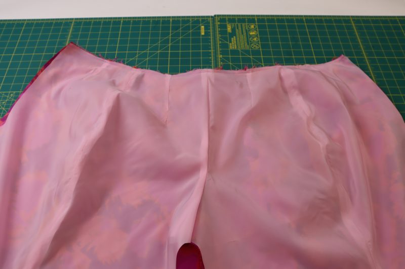How To Sew Pants Waistlines Together - Stretch Polyester Twill Lining - Mood Fabrics - Chelsea Brocade Set Free Sewing Pattern Tutorial - MDF508 - Mood Fabrics Sewciety Blog - Sew the waistlines of the lining and brocade pants together.