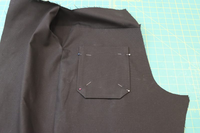 How To Pin Back Pockets To Back Pants - Cotton Canvas - Mood Fabrics - Clarkston Carpenter Pants Free Sewing Pattern Tutorial - MDF503 - Mood Fabrics Sewciety Blog - Pin the back pockets to the back pants pieces.