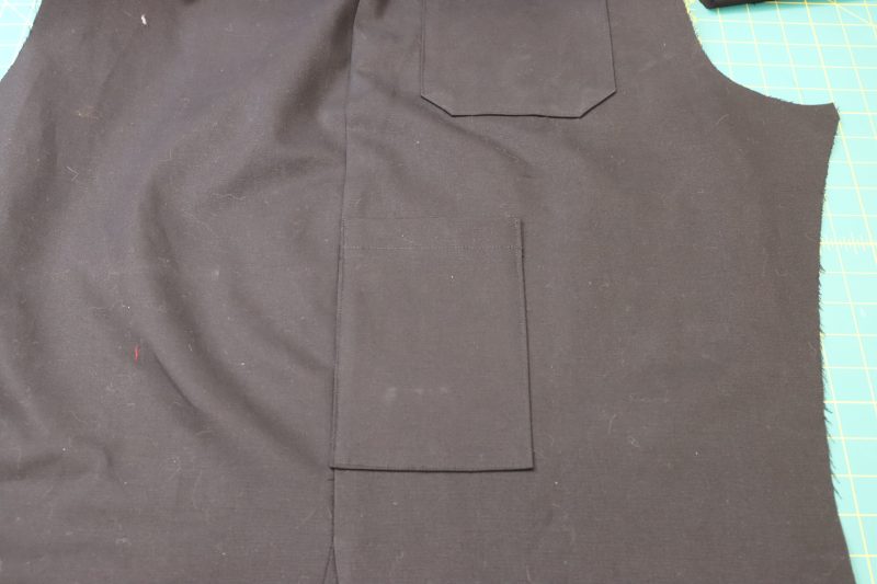 How To Pin Sew Side Pockets To Pants - Cotton Canvas - Mood Fabrics - Clarkston Carpenter Pants Free Sewing Pattern Tutorial - MDF503 - Mood Fabrics Sewciety Blog - Pin and sew the sides and bottom of the pocket to secure to the side of the pants.