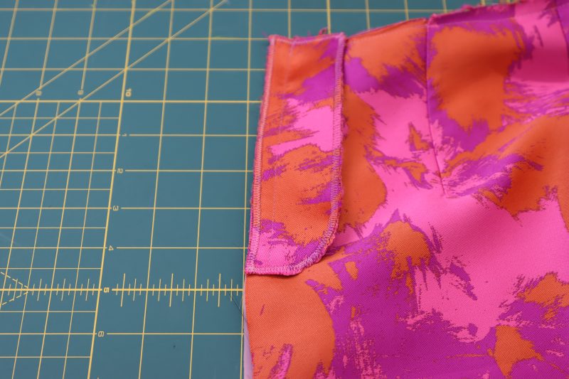 How To Sew Fly Facing To Front Pants - Luxury Polyester Brocade - Mood Fabrics - Chelsea Brocade Set Free Sewing Pattern Tutorial - MDF508 - Mood Fabrics Sewciety Blog - Sew the fly facing to the wearer’s left side of the pants.