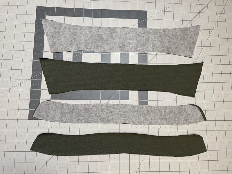 How To Iron Fusible Interfacing Into Collar - Fusible Interfacing - Mood Fabrics - Cove Collared Wrap Top Free Sewing Pattern Tutorial - MDF498 - Mood Fabrics Sewciety Blog - Iron fusible interfacing to one of each collar and collar stand piece.