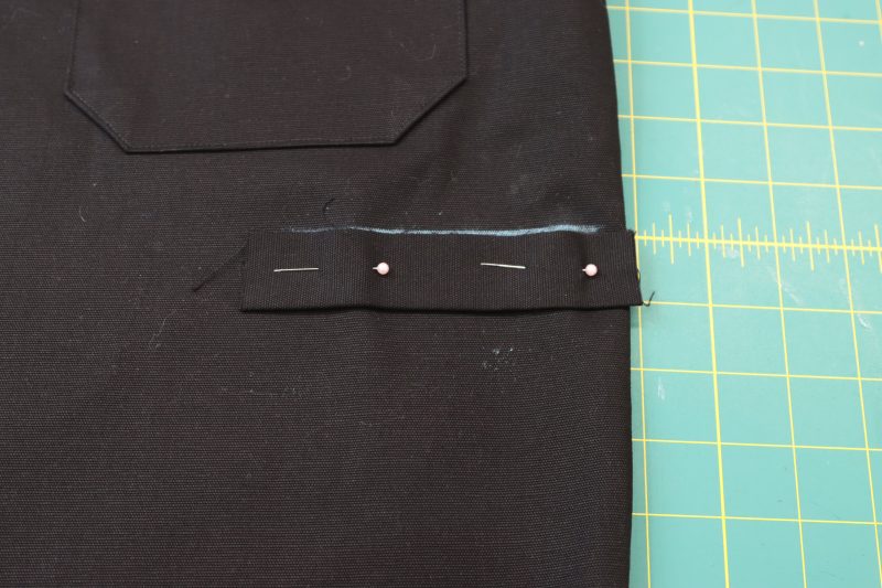 How To Pin Welt To Chalk LInes - Cotton Canvas - Mood Fabrics - Clarkston Carpenter Pants Free Sewing Pattern Tutorial - MDF503 - Mood Fabrics Sewciety Blog - Pin the welt to the bottom chalk line.
