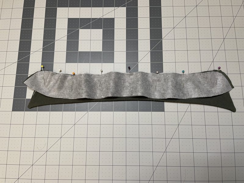 How To Sandwich Collar Between Collar Stand - Stretch Liverpool Knit - Mood Fabrics - Cove Collared Wrap Top Free Sewing Pattern Tutorial - MDF498 - Mood Fabrics Sewciety Blog - Sandwich the collar in between the curved edges of the two collar stand pieces.