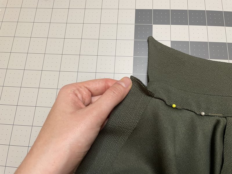 How To Clip Button Placket - Stretch Liverpool Knit - Mood Fabrics - Cove Collared Wrap Top Free Sewing Pattern Tutorial - MDF498 - Mood Fabrics Sewciety Blog - Clip the space between the placket and the collar stand.