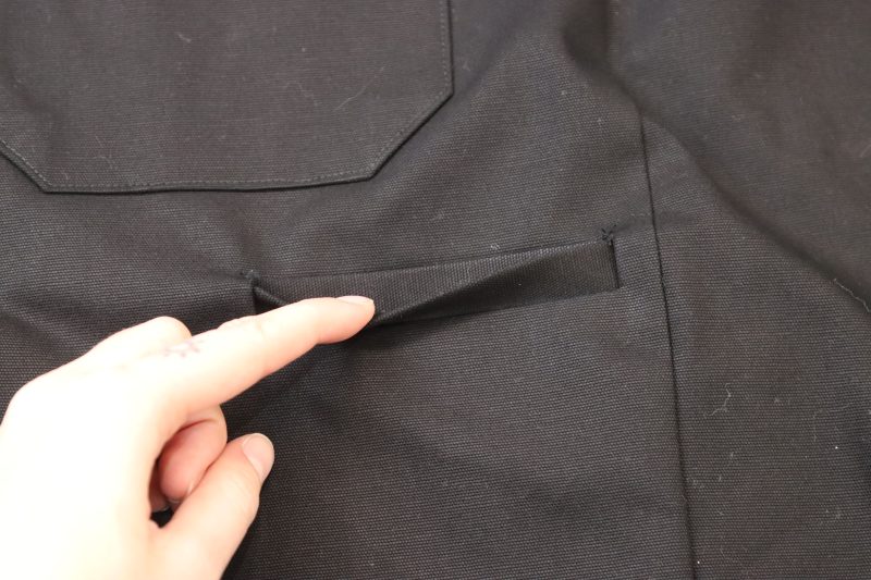 How To Flip Welt Lining To Wrong Side - Cotton Canvas - Mood Fabrics - Clarkston Carpenter Pants Free Sewing Pattern Tutorial - MDF503 - Mood Fabrics Sewciety Blog - Flip the welt and pocket lining towards the wrong side of the pants.