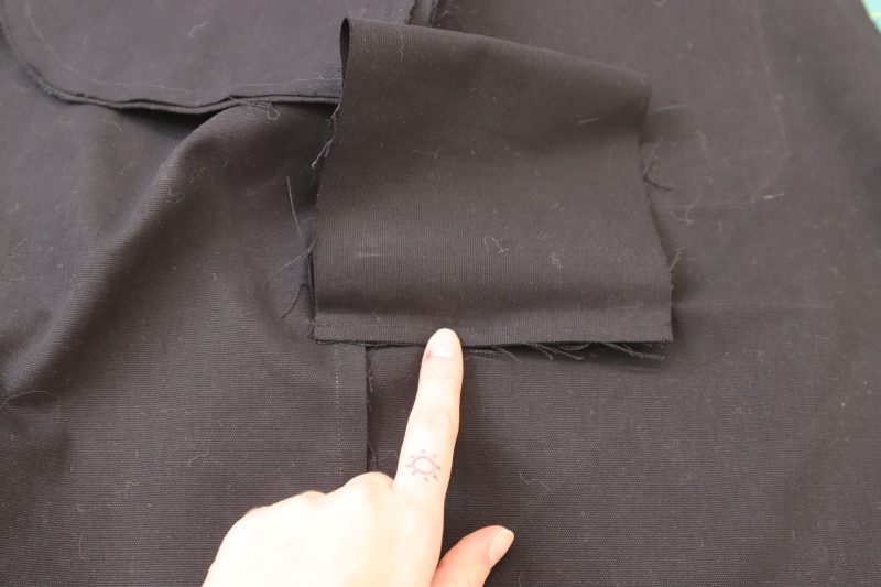 How To Sew Bottom Welt Pocket Lining - Cotton Canvas - Mood Fabrics - Clarkston Carpenter Pants Free Sewing Pattern Tutorial - MDF503 - Mood Fabrics Sewciety Blog - Sew the bottom of the welt lining to the raw edge of the welt.
