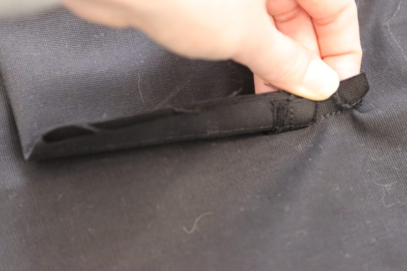 How To Sew Welt Lining Sides - Cotton Canvas - Mood Fabrics - Clarkston Carpenter Pants Free Sewing Pattern Tutorial - MDF503 - Mood Fabrics Sewciety Blog - Sew the side seams of the welt lining to the triangular cutout to secure the welt pocket.
