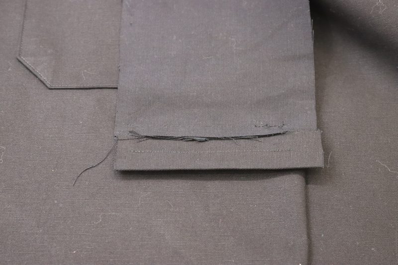 How To Sew Welt Pocket Lining - Cotton Canvas - Mood Fabrics - Clarkston Carpenter Pants Free Sewing Pattern Tutorial - MDF503 - Mood Fabrics Sewciety Blog - Sew the welt pocket lining to the top chalk mark.