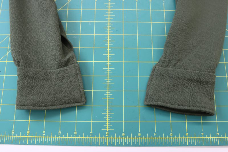 How To Mark Cuff Buttonholes - Stretch Liverpool Knit - Mood Fabrics - Cove Collared Wrap Top Free Sewing Pattern Tutorial - MDF498 - Mood Fabrics Sewciety Blog - Mark the spots for the buttons and buttonholes on the sleeve cuffs.