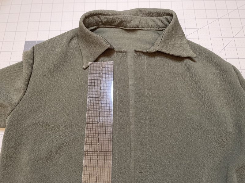 How To Mark Spot For Buttons - Stretch Liverpool Knit - Mood Fabrics - Cove Collared Wrap Top Free Sewing Pattern Tutorial - MDF498 - Mood Fabrics Sewciety Blog - Mark the spots for the buttons and buttonholes.