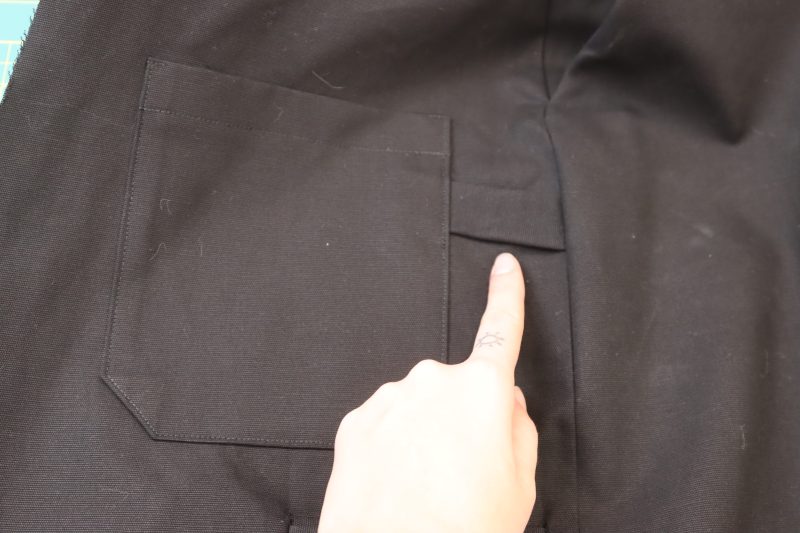 How To Topstitch Strap Under Back Pocket - Cotton Canvas - Mood Fabrics - Clarkston Carpenter Pants Free Sewing Pattern Tutorial - MDF503 - Mood Fabrics Sewciety Blog - Topstitch the back pocket and sew the side seam to secure the strap in both.