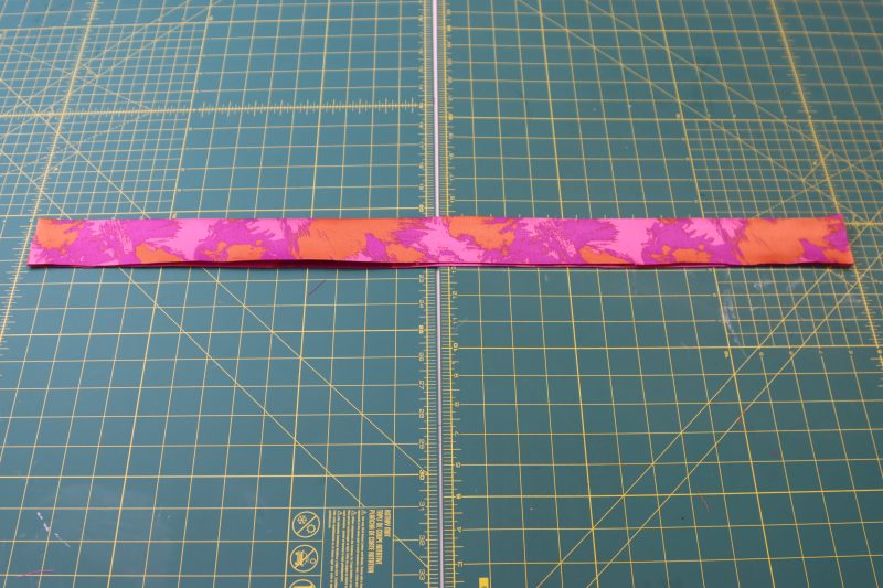 How To Flip Waistband Right Sides Out - Luxury Polyester Brocade - Mood Fabrics - Chelsea Brocade Set Free Sewing Pattern Tutorial - MDF508 - Mood Fabrics Sewciety Blog - Flip the waistband right sides out.
