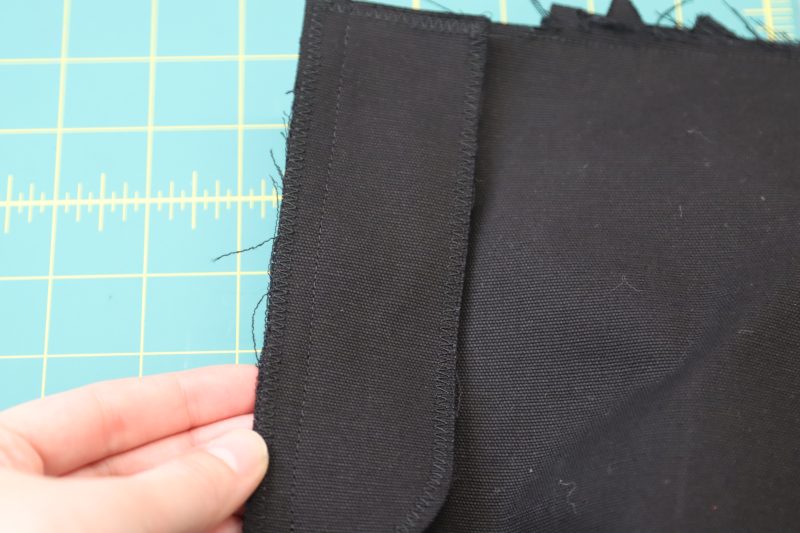 How To Pin Sew Fly Facing - Cotton Canvas - Mood Fabrics - Clarkston Carpenter Pants Free Sewing Pattern Tutorial - MDF503 - Mood Fabrics Sewciety Blog - Pin and sew the fly facing to the front left pants piece.
