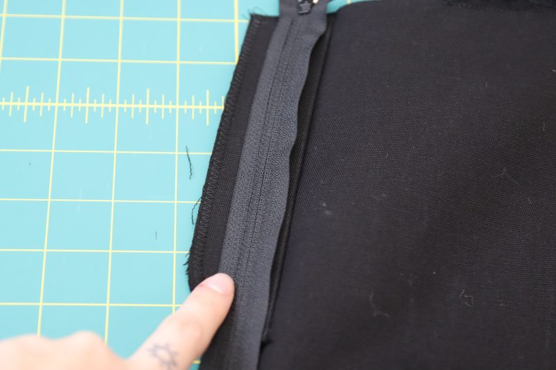 How To Pin Sew Zipper To Fly Facing - Regular Zipper - Mood Fabrics - Clarkston Carpenter Pants Free Sewing Pattern Tutorial - MDF503 - Mood Fabrics Sewciety Blog - Pin and sew the zipper to the fly facing.