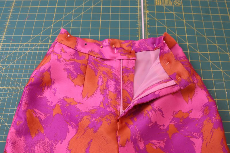 How To Topstitch Wasitband To Pants - Luxury Polyester Brocade - Mood Fabrics - Chelsea Brocade Set Free Sewing Pattern Tutorial - MDF508 - Mood Fabrics Sewciety Blog - Topstitch the waistband onto the pants.