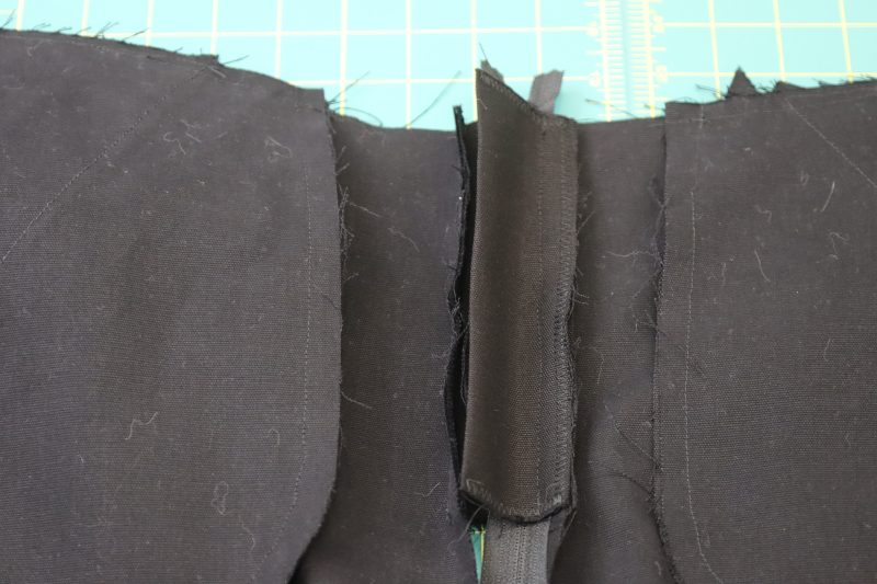 How To Sandwich Zipper Between Fly Shield And Pants - Regular Zipper - Mood Fabrics - Clarkston Carpenter Pants Free Sewing Pattern Tutorial - MDF503 - Mood Fabrics Sewciety Blog - Sandwich the zipper between the fly shield and the right side of the pants.