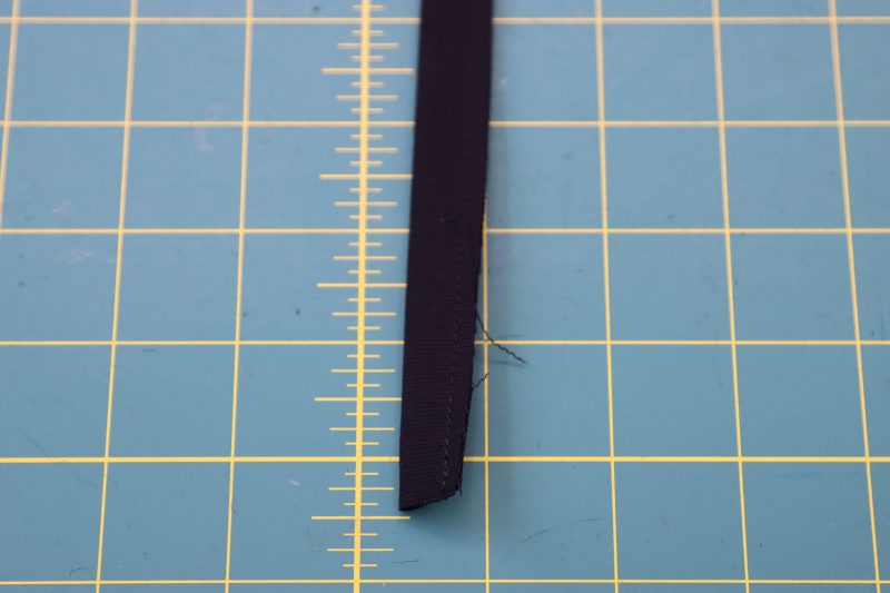 How To Sew Belt Loop Right Sides Together - Cotton Canvas - Mood Fabrics - Clarkston Carpenter Pants Free Sewing Pattern Tutorial - MDF503 - Mood Fabrics Sewciety Blog - Sew the belt loop strip with ⅛ inch seam allowance.