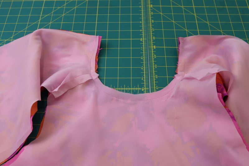 How To Sew Necklines Together - Stretch Polyester Twill Lining - Mood Fabrics - Chelsea Brocade Set Free Sewing Pattern Tutorial - MDF508 - Mood Fabrics Sewciety Blog - Sew the necklines together.