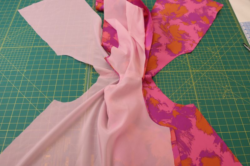How To Insert Top Between Shell And Lining - Luxury Polyester Brocade - Mood Fabrics - Chelsea Brocade Set Free Sewing Pattern Tutorial - MDF508 - Mood Fabrics Sewciety Blog - Stuff the other half of the top in between the lining and brocade on the side where they were separated.