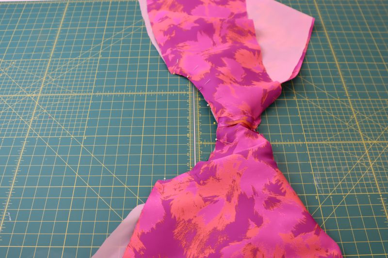 How To Pin Armscyes - Luxury Polyester Brocade - Mood Fabrics - Chelsea Brocade Set Free Sewing Pattern Tutorial - MDF508 - Mood Fabrics Sewciety Blog - Fold the lining and brocade around the rest of the top and pin the armscye.