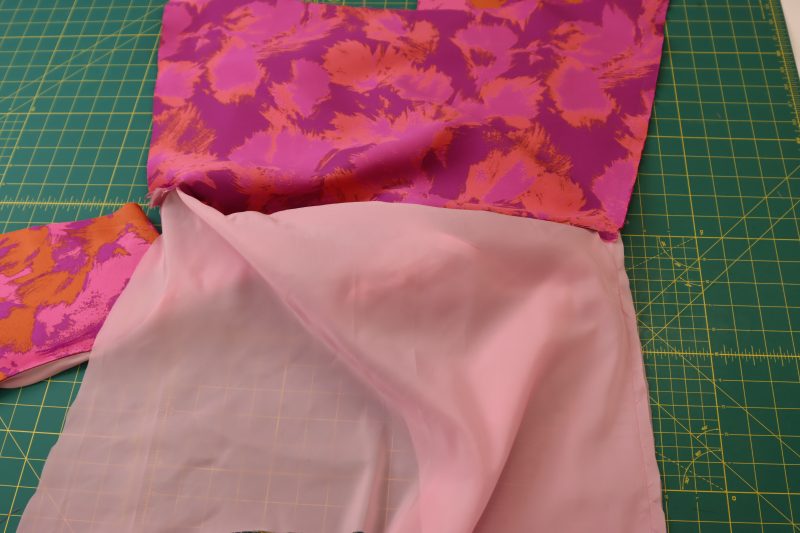 How To Sew Left Side Seam - Luxury Polyester Brocade - Mood Fabrics - Chelsea Brocade Set Free Sewing Pattern Tutorial - MDF508 - Mood Fabrics Sewciety Blog - Sew one seam from the bottom hem of the brocade, to the armpit, to the bottom hem of the lining.
