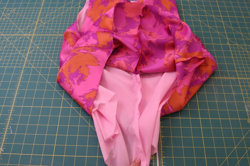 How To Pin Sew Center Back Seam Under Zipper - Luxury Polyester Brocade - Mood Fabrics - Chelsea Brocade Set Free Sewing Pattern Tutorial - MDF508 - Mood Fabrics Sewciety Blog - Pin and sew the center back seams under the zipper.