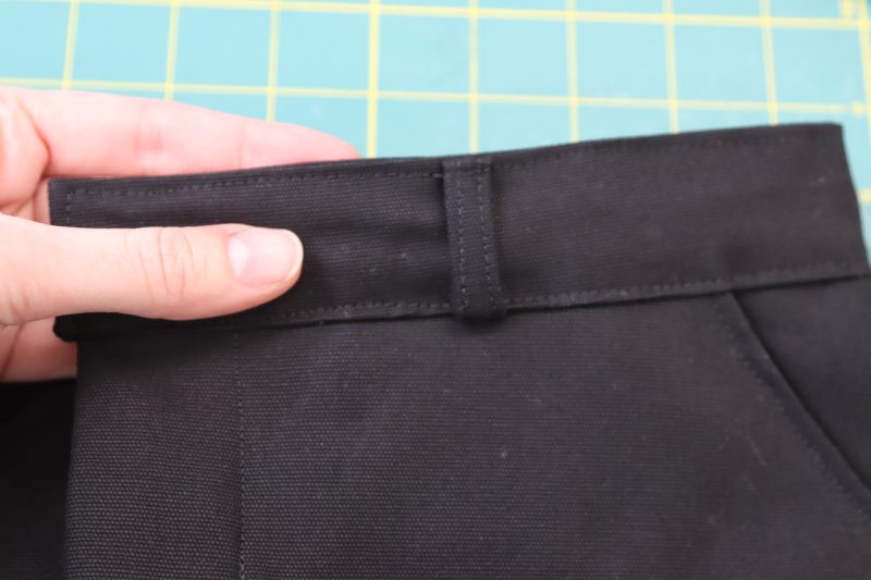 How To Topstitch Waistband And Belt Loops - Cotton Canvas - Mood Fabrics - Clarkston Carpenter Pants Free Sewing Pattern Tutorial - MDF503 - Mood Fabrics Sewciety Blog - Topstitch over the top of the waistband and belt loops.