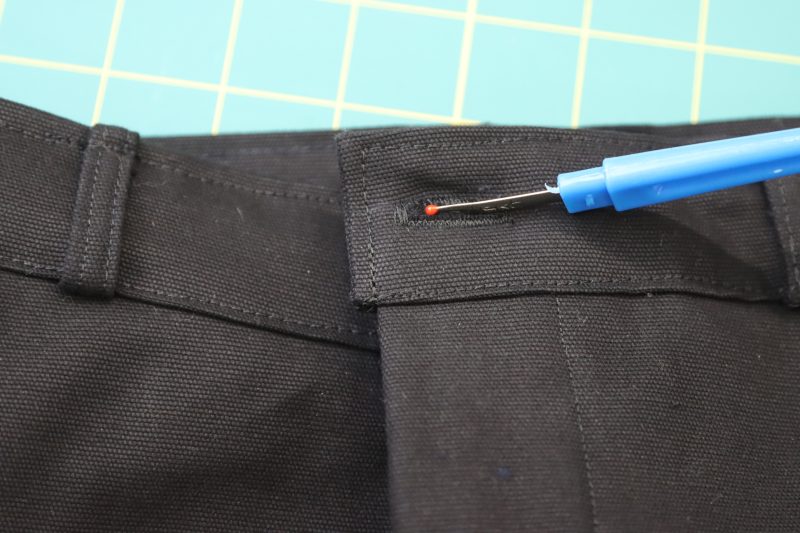 How To Open Buttonhole With Seam Ripper - Cotton Canvas - Mood Fabrics - Clarkston Carpenter Pants Free Sewing Pattern Tutorial - MDF503 - Mood Fabrics Sewciety Blog - Open the buttonhole with a seam ripper.