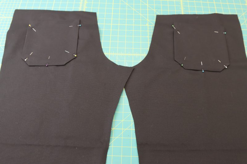 How To Pin Sew Back Pockets To Pants - Cotton Canvas - Mood Fabrics - Colfax Carpenter Pants Free Sewing Pattern Tutorial - MDF504 - Mood Fabrics Sewciety Blog - Pin and sew the back pockets to the back pants pieces.