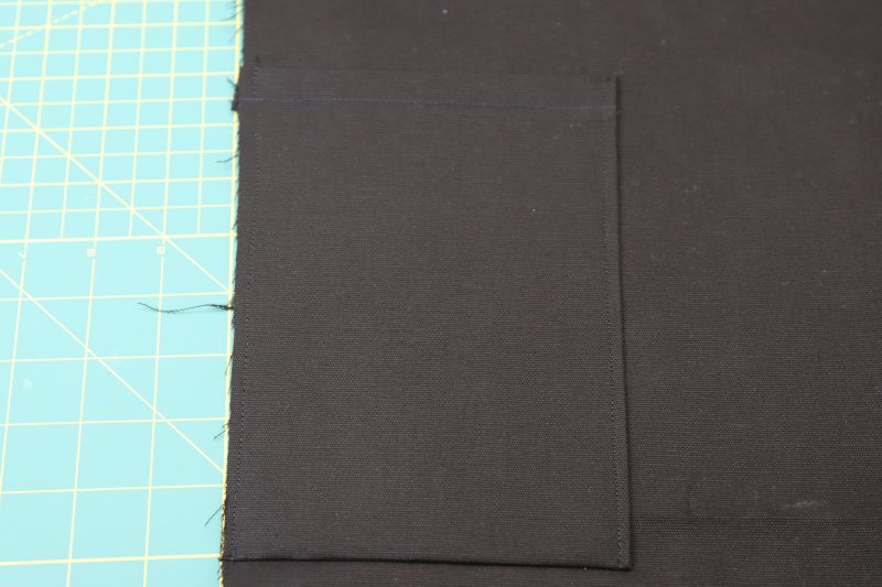 How To Flip Side Pocket Up - Cotton Canvas - Mood Fabrics - Colfax Carpenter Pants Free Sewing Pattern Tutorial - MDF504 - Mood Fabrics Sewciety Blog - Flip the pocket up and topstitch over the sides.