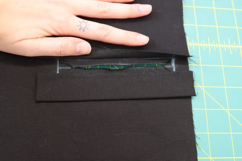 How To Cut Welt Opening - Cotton Canvas - Mood Fabrics - Colfax Carpenter Pants Free Sewing Pattern Tutorial - MDF504 - Mood Fabrics Sewciety Blog - Cut the welt pocket open as shown in the photo.