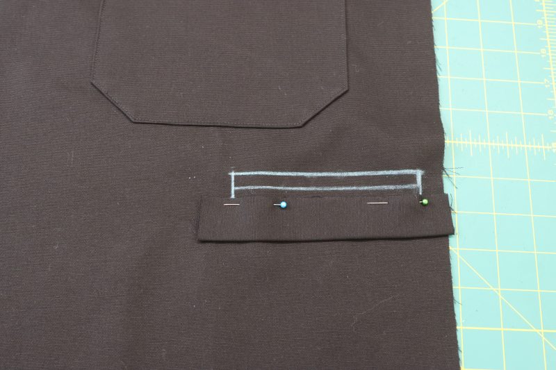 How To Pin Sew Welt To Chalk Lines - Cotton Canvas - Mood Fabrics - Colfax Carpenter Pants Free Sewing Pattern Tutorial - MDF504 - Mood Fabrics Sewciety Blog - Pin and sew the welt to the bottom chalk line.