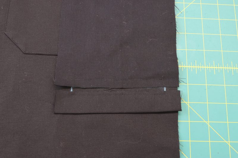 How To Sew Welt Lining To Chalk Lines - Cotton Canvas - Mood Fabrics - Colfax Carpenter Pants Free Sewing Pattern Tutorial - MDF504 - Mood Fabrics Sewciety Blog - Sew the pocket lining to the top chalk line.