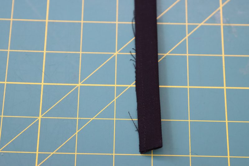 How To Sew Belt Loop Right Sides Together - Cotton Canvas - Mood Fabrics - Colfax Carpenter Pants Free Sewing Pattern Tutorial - MDF504 - Mood Fabrics Sewciety Blog - Sew the belt loop strip in half long ways, right sides together.