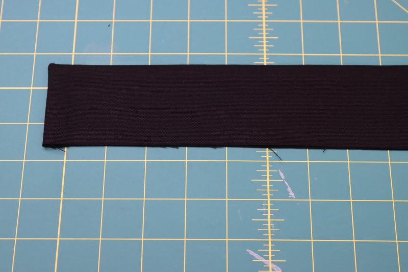 How To Flip Waistband Right Sides Out - Cotton Canvas - Mood Fabrics - Colfax Carpenter Pants Free Sewing Pattern Tutorial - MDF504 - Mood Fabrics Sewciety Blog - Flip the waistband right sides out.