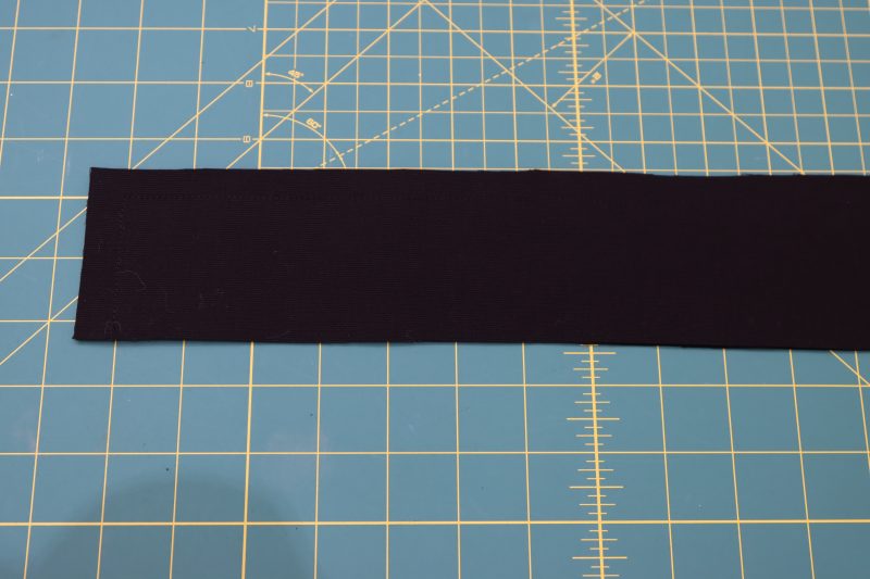 How To Place Waistbands Right Sides Together - Cotton Canvas - Mood Fabrics - Colfax Carpenter Pants Free Sewing Pattern Tutorial - MDF504 - Mood Fabrics Sewciety Blog - Place the waistbands right sides together and sew them together on three sides.