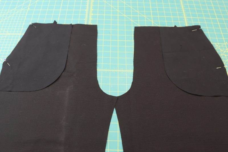 How To Pin Pocket A To Front Pants - Cotton Canvas - Mood Fabrics - Colfax Carpenter Pants Free Sewing Pattern Tutorial - MDF504 - Mood Fabrics Sewciety Blog - Pin the A pockets to the fronts of the pants at the side seam.