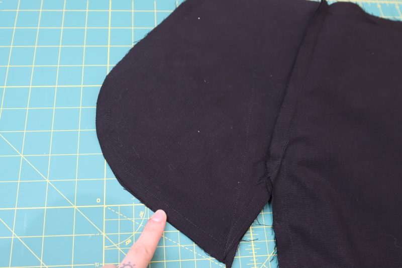 How To Pin Sew Front Pocket Bags - Cotton Canvas - Mood Fabrics - Colfax Carpenter Pants Free Sewing Pattern Tutorial - MDF504 - Mood Fabrics Sewciety Blog - Pin and sew the front and back pants pieces together around the pocket bag.