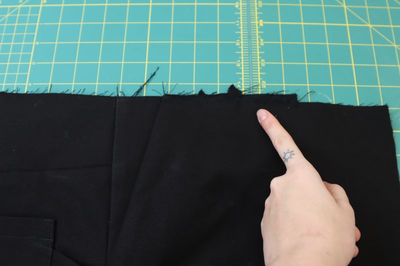 How To Sew Front Pockets To Waistline - Cotton Canvas - Mood Fabrics - Colfax Carpenter Pants Free Sewing Pattern Tutorial - MDF504 - Mood Fabrics Sewciety Blog - Sew the front pockets to the waistline.