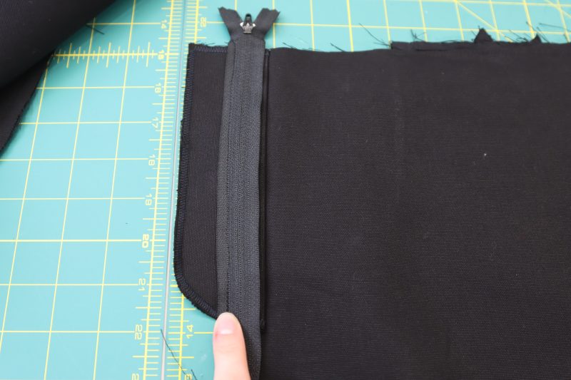 How To Sew Zipper Right Sides Together - Regular Zipper - Mood Fabrics - Colfax Carpenter Pants Free Sewing Pattern Tutorial - MDF504 - Mood Fabrics Sewciety Blog - Sew the zipper right sides together with the fly facing.