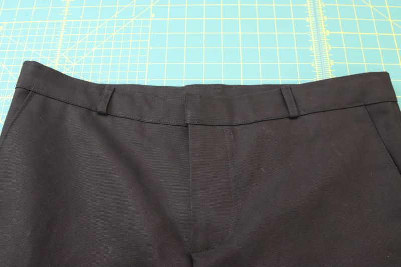 How To Topstitch Waistband And Belt Loops - Cotton Canvas - Mood Fabrics - Colfax Carpenter Pants Free Sewing Pattern Tutorial - MDF504 - Mood Fabrics Sewciety Blog - Topstitch the top and bottom of the waistband, including the belt loops.