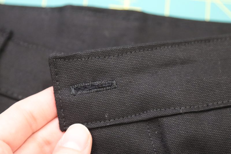 How To Sew Button Hole - Gutermann Sew All Thread - Mood Fabrics - Colfax Carpenter Pants Free Sewing Pattern Tutorial - MDF504 - Mood Fabrics Sewciety Blog - Sew a buttonhole into the front overlapping waistband.