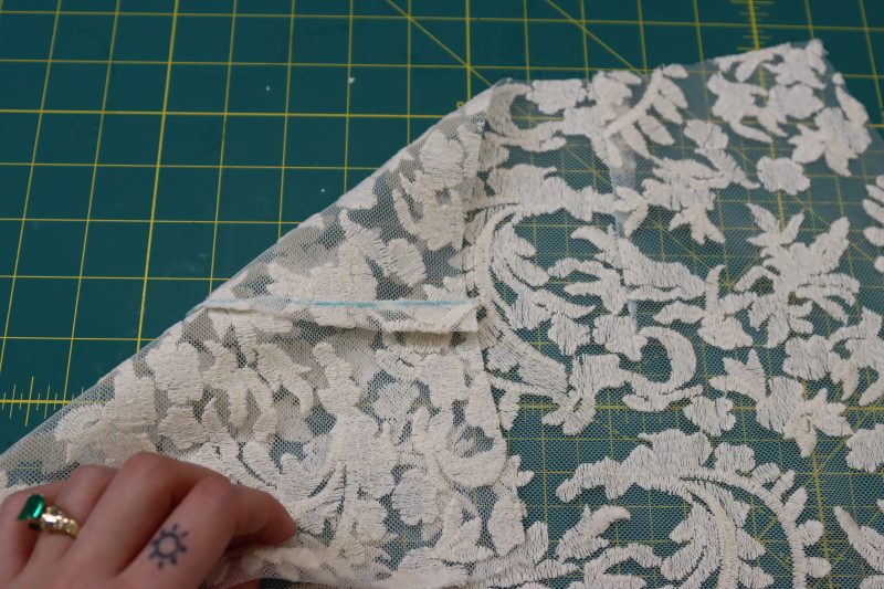 How To Press Darts Towards Sides - Embroidered Lace - Mood Fabrics - Taiga Trapeze Skirt Free Sewing Pattern Tutorial - MDF512 - Mood Fabrics Sewciety Blog - Press the darts towards the sides of the skirt.
